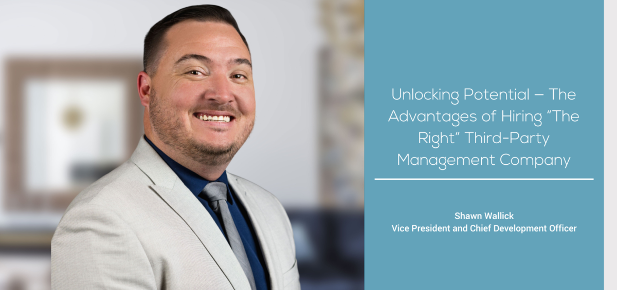 a man in a suit smiling for the camera